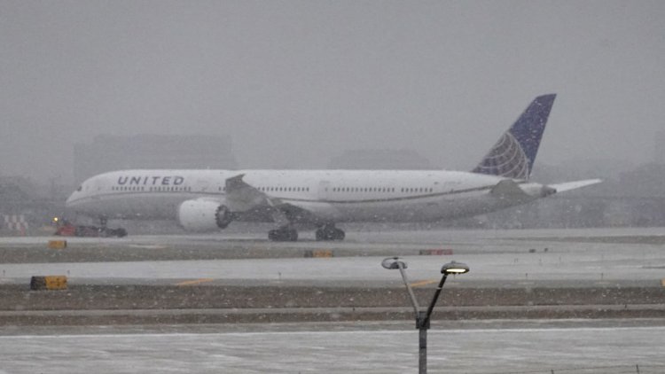 Airlines cancel more than 12,000 flights during severe winter storms and scramble to rebook holiday travelers