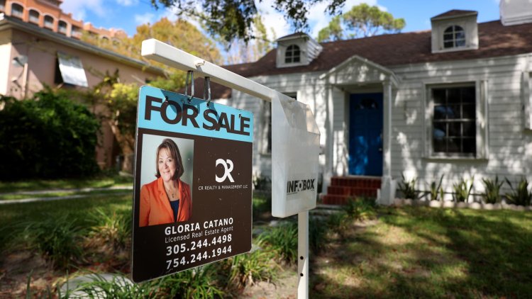 Pending home sales squeezed out a tiny gain in February, as mortgage rates jumped