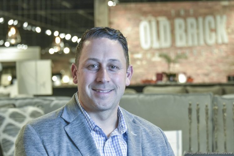 Old Brick Furniture buys retail plaza to expand again